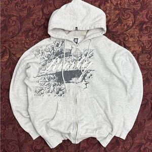 Rusty Light Gray Zip-Up Hoodie with Dark Gray Graphic